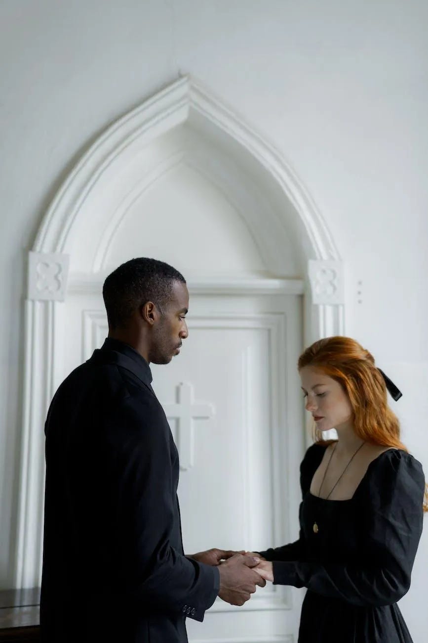 a man praying with a woman a man praying with a woman