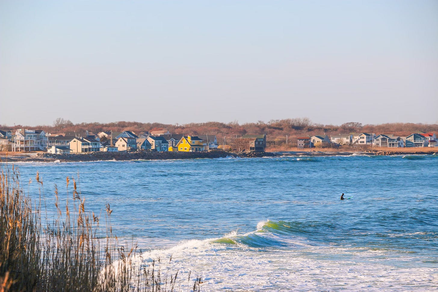 Daytime view of a body of water near buildings. 