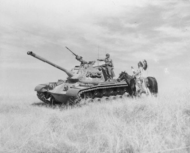 Thomas K. Yallup, chief of the Yakama tribe of Washington State, visits his son, training in an M48 Patton at the Yakima Firing Center, 1954 Thomas K. Yallup, chief of the Yakama tribe of Washington State, visits his son, training in an M48 Patton at the Yakima Firing Center, 1954