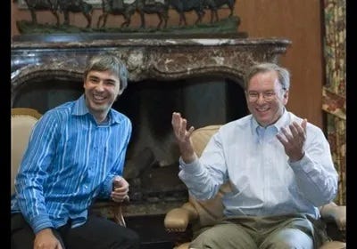 Larry Page and Eric Schmidt speaking to reporters at a media summit in 2009 Larry Page and Eric Schmidt speaking to reporters at a media summit in 2009