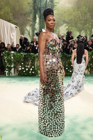 Image may contain Venus Williams Adult Person Fashion Wedding Camera Electronics Clothing Dress and Footwear