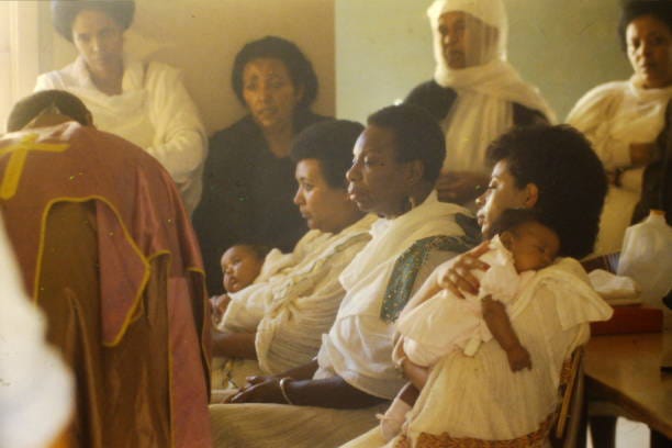 Singer-songwriter Nina Simone is Baptized into the Ethiopian Orthodox Church by Fr. Amde Hamilton circa 1988 in Los Angeles, California.