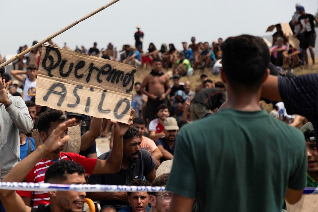 Migrants seek asylum in Ceuta after crossing from Morocco