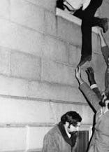 A person reaching out to the side of a wall

AI-generated content may be incorrect.