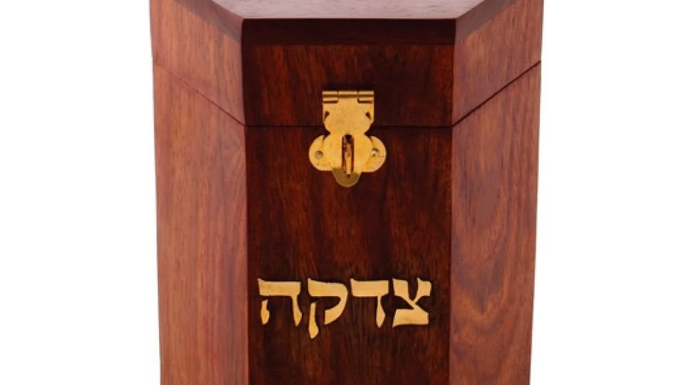 May be an image of ‎text that says '‎צדקה‎'‎