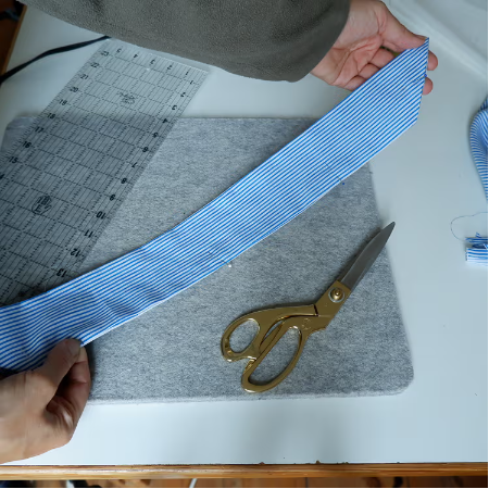 showing the strip on a sewing table with the marks showing the strip on a sewing table with the marks