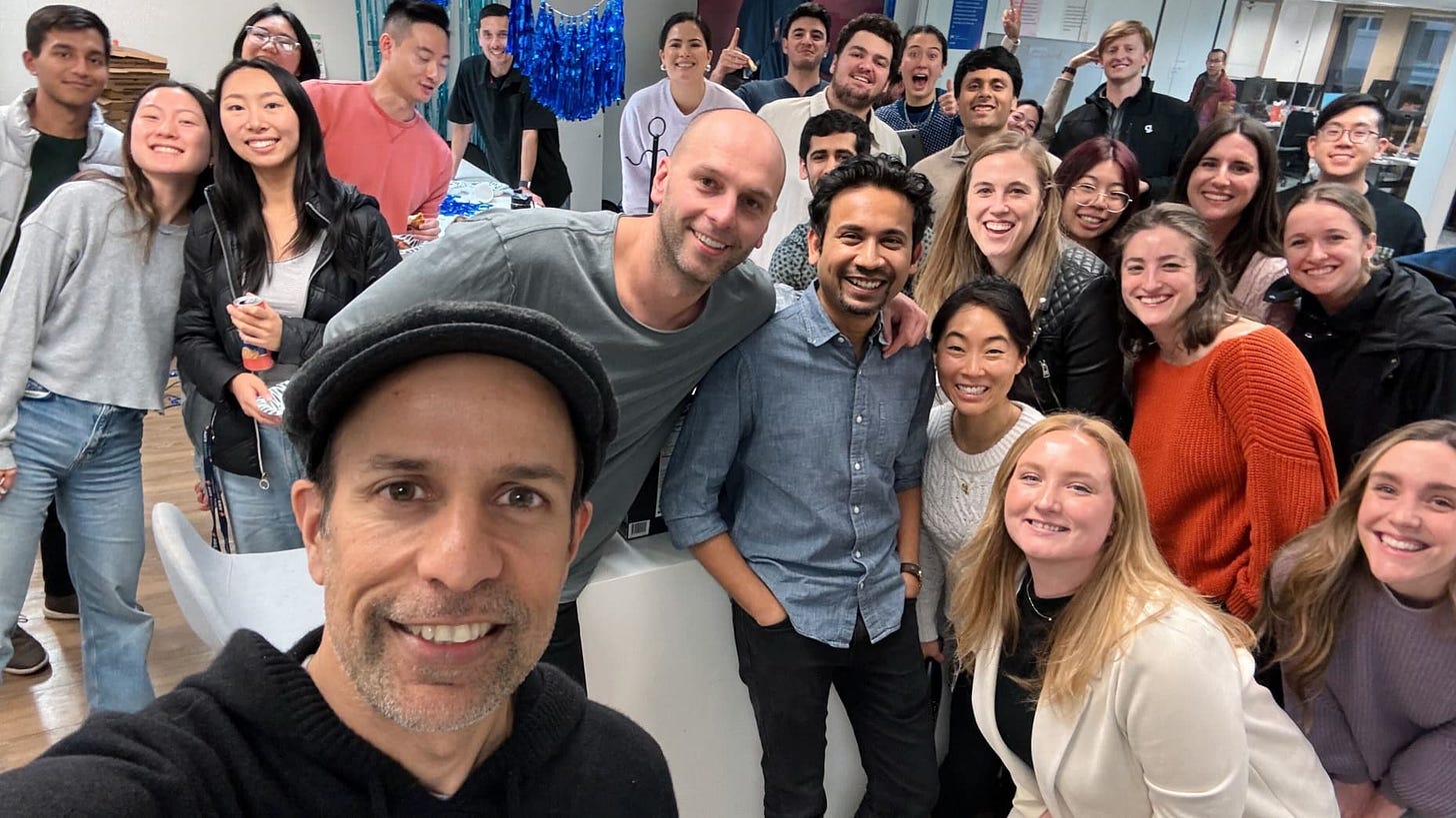 Arvind Jain, co-founder and CEO of Glean, makes a selfie with employees of the startup, which is based in Palo Alto, Calif.