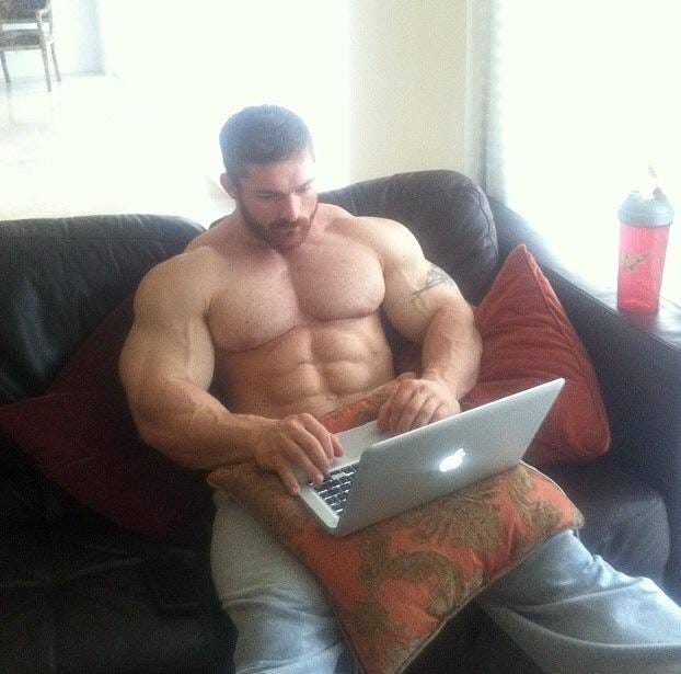 sexy hunk on laptop