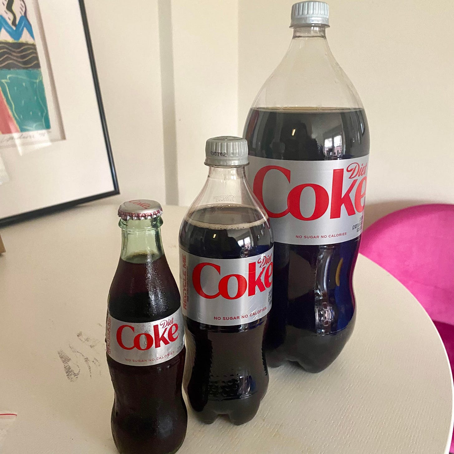 Three Diet Cokes of varying sizes in harmony Three Diet Cokes of varying sizes in harmony