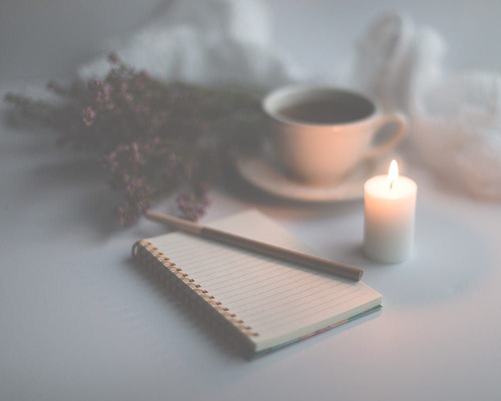 A soft, calming scene with a candlelit journal, fresh coffee, and flowers — inviting you to pause, reflect, and return to yourself through writing. A soft, calming scene with a candlelit journal, fresh coffee, and flowers — inviting you to pause, reflect, and return to yourself through writing.