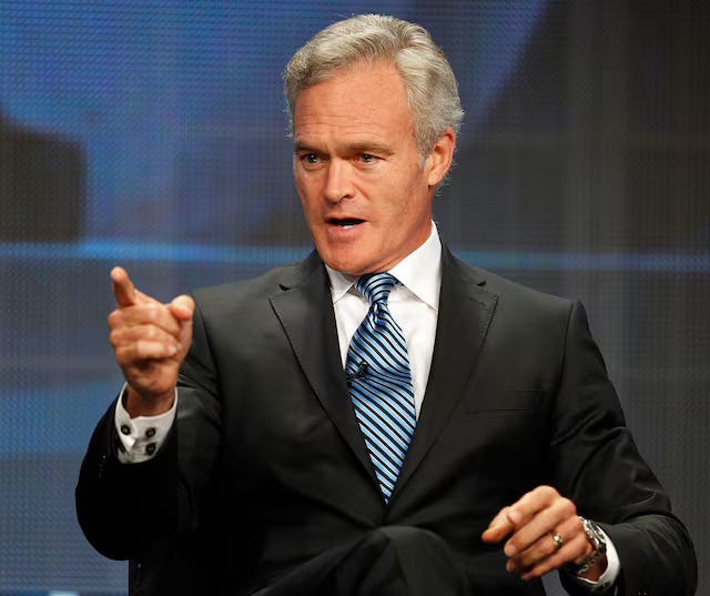 Woman with brown hair wearing a black top with multicolored scarf; protesters and ICE agents; man with brown hair wearing a white dress shirt, ti, and black blazer; man with short black hair wearing a salmon-colored turtleneck and black blazer; man with gray hair wearing a white dress shirt, tie and black blazer.
