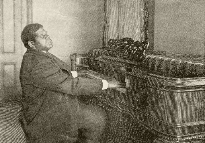 Thomas “Blind Tom” Wiggins playing the piano. He is leaning back on his bench, feeling the music. Thomas “Blind Tom” Wiggins playing the piano. He is leaning back on his bench, feeling the music.