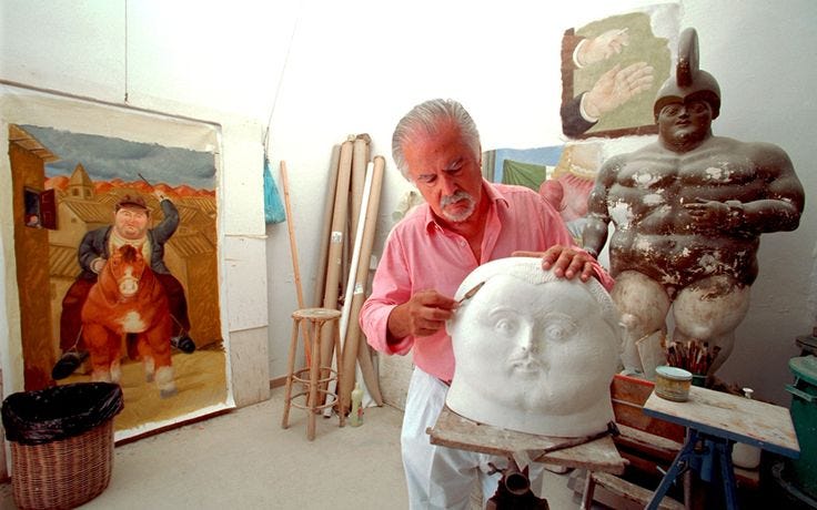 This may contain: a man is working on a sculpture in his studio