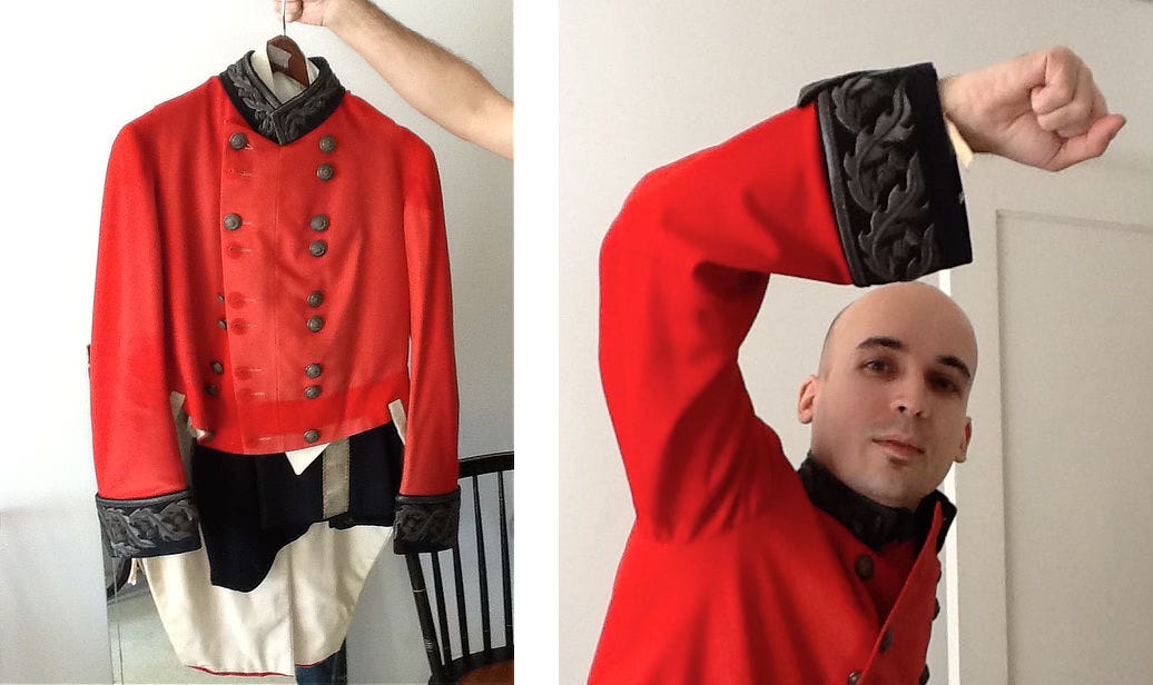 LEFT: Photo of a beautiful red coat with thick black cuffs on the sleeve, knobby buttons running in two lines up the front, and a black collar sans lapels. RIGHT: Photo of Dan dos Santos in the red jacket holding his arm up overhead, closely resembling the cover pose but without sword. LEFT: Photo of a beautiful red coat with thick black cuffs on the sleeve, knobby buttons running in two lines up the front, and a black collar sans lapels. RIGHT: Photo of Dan dos Santos in the red jacket holding his arm up overhead, closely resembling the cover pose but without sword.
