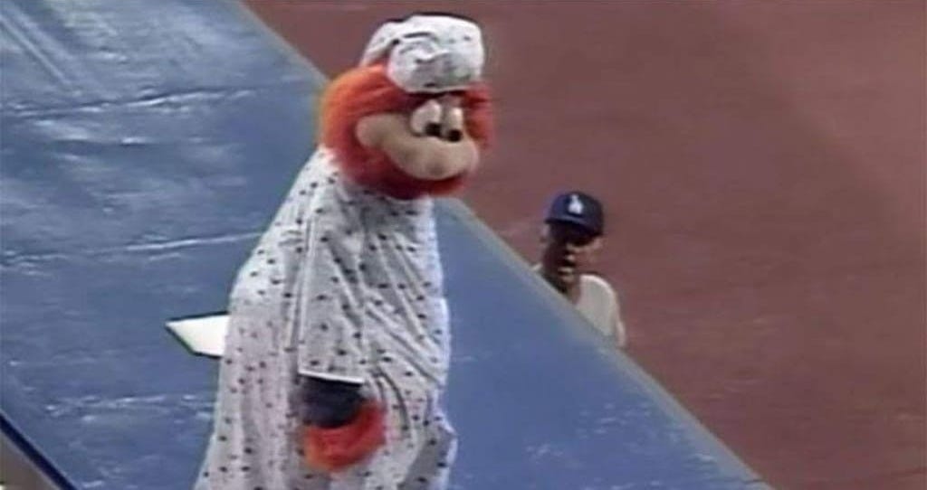 A banished Youppi prepares to leave the Dodgers' dugout roof. A banished Youppi prepares to leave the Dodgers' dugout roof.