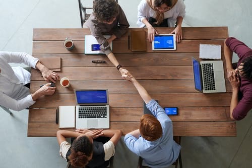 Group of Person Sitting Indoors Group of Person Sitting Indoors