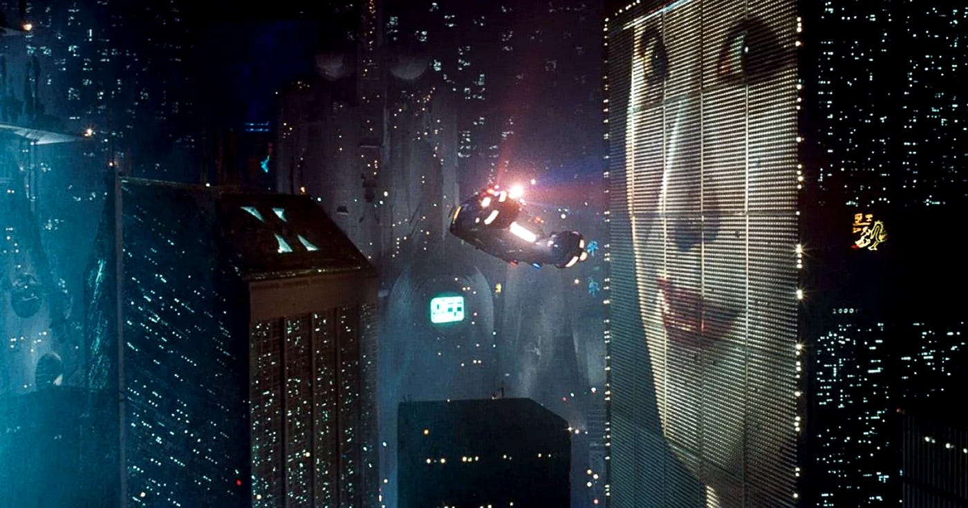 Iconic shot from Blade Runner (1982) featuring a flying police spinner against the dystopian Los Angeles skyline, with a towering digital billboard of a woman's face illuminating the night. Iconic shot from Blade Runner (1982) featuring a flying police spinner against the dystopian Los Angeles skyline, with a towering digital billboard of a woman's face illuminating the night.
