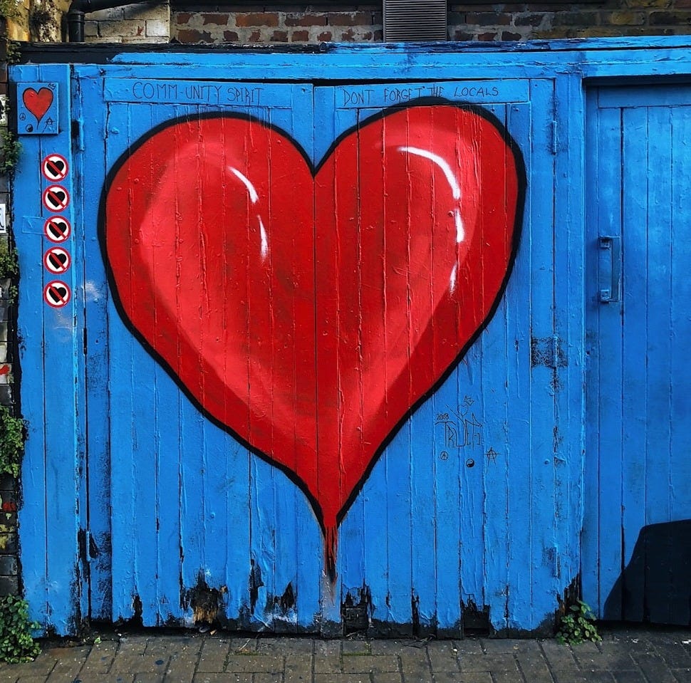 blue wooden gate with a red heart painted on it blue wooden gate with a red heart painted on it