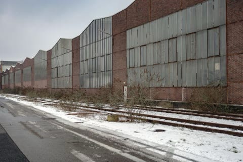 A disused works beside an abandoned railway siding A disused works beside an abandoned railway siding
