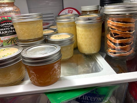 boiling lemons to make marmalade. Jars and jars of marmalade and lemon curd.