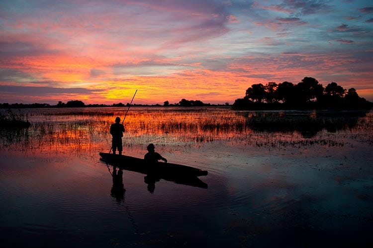 https://www.safarispecialists.net/img/areas/okavango-delta/slide-images/Okavango-sunset.jpg