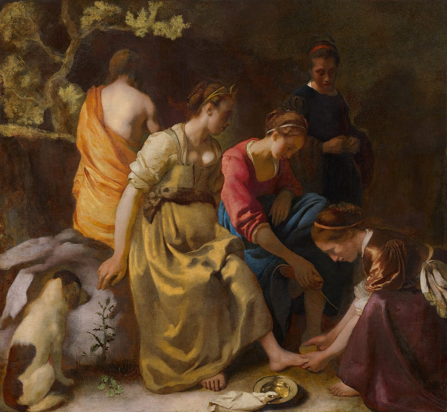 In a dark clearing a nymph kneels to wash the foot of Diana, who wears a crescent on her head, while a small dog lies at the left and two more nymphs sit and stand beside them.