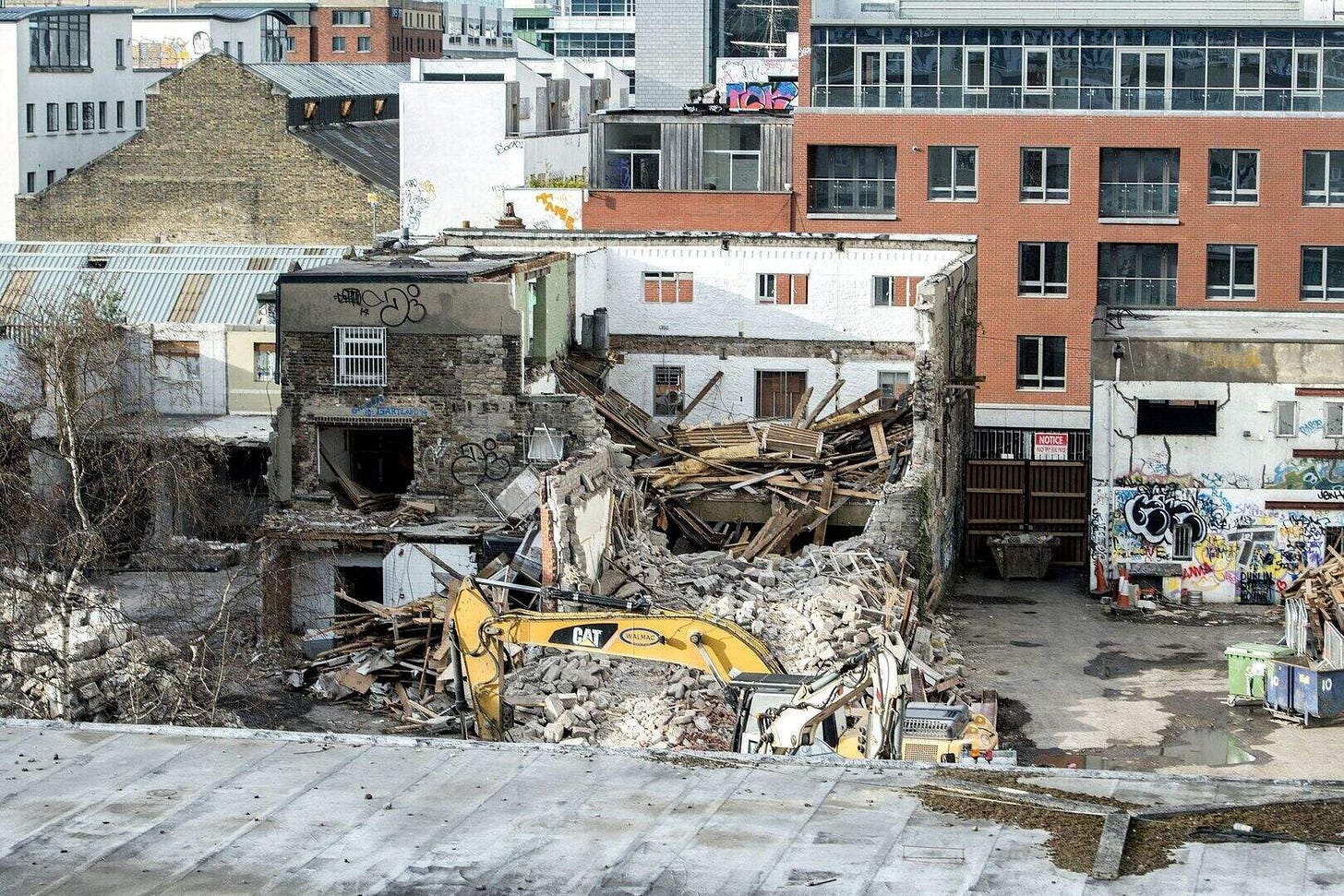 The demolition of the iconic Windmill Lane Studios where U2 recorded has left just the famous graffiti-covered walls remaining The demolition of the iconic Windmill Lane Studios where U2 recorded has left just the famous graffiti-covered walls remaining