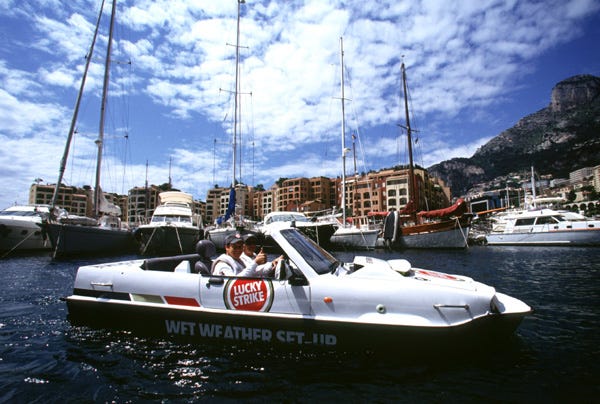 May be an image of 2 people, people boat racing, boat, Camogli and text that says "LUCKY LUCKY STRIKE" May be an image of 2 people, people boat racing, boat, Camogli and text that says "LUCKY LUCKY STRIKE"