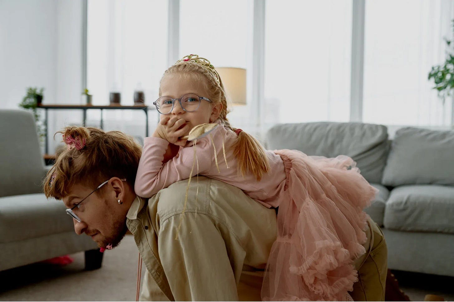 Daddy on all fours carrying his little princess