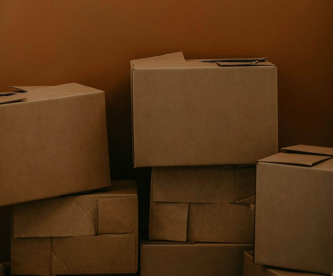 white cardboard box on brown wooden table
