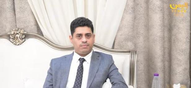 May be an image of one or more people, newsroom and text