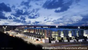 Complex of Google data center in Atlanta, illuminated beneath a sky at dusk.