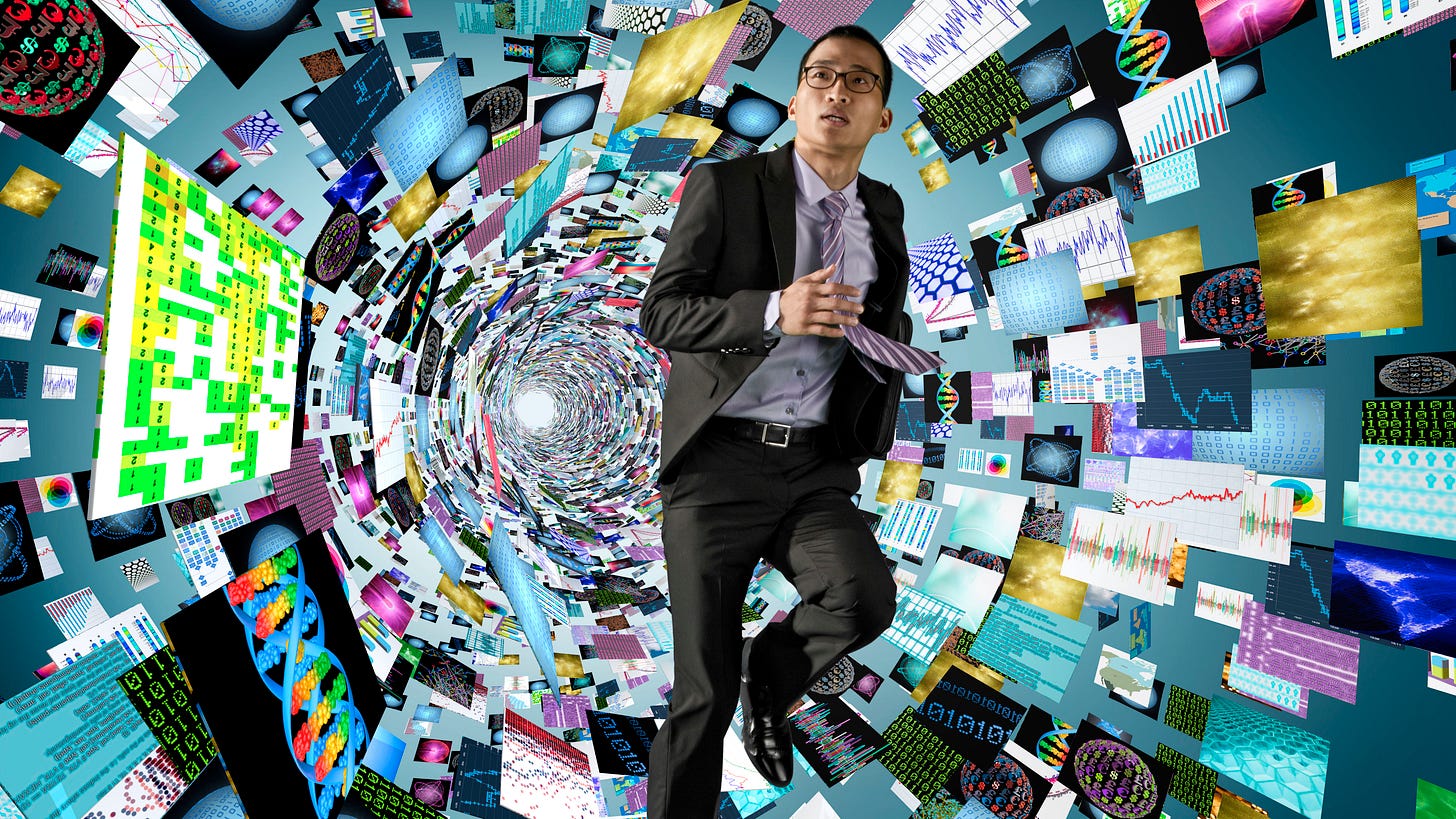 A man in a suit stands still while papers and digital icons swirl around him in a blur, capturing the feeling of mental overload and being pulled in many directions at once.