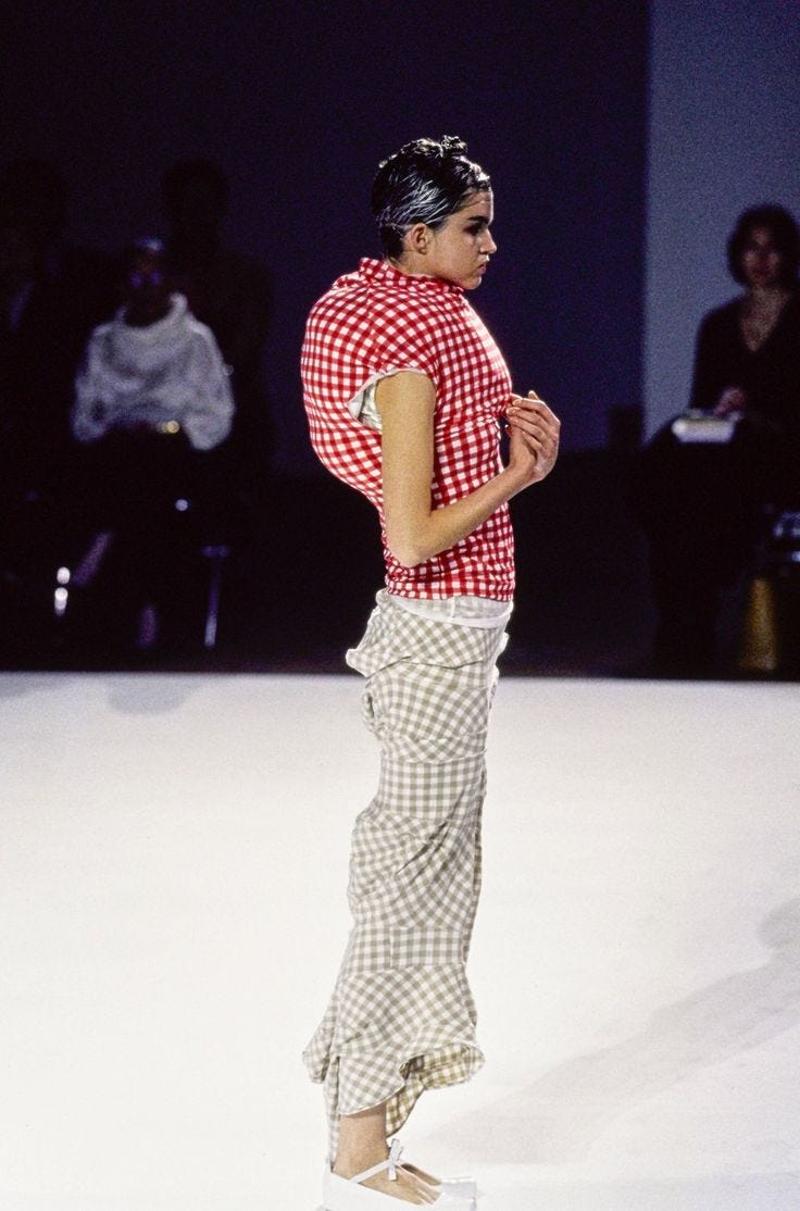 commes des garcons 1997 runway collection red plaid hunched top and grey plaid skirt