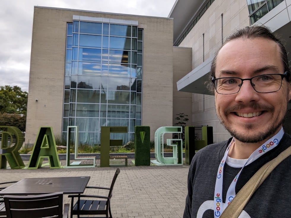 Me against the Raleigh sign outside the ATO conference