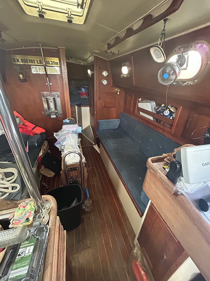 Pacific Seacraft sailboat on lift and stands. Pacific Seacraft interior organization.