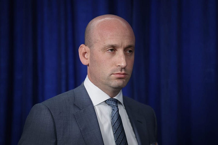 White House Deputy Chief of Staff and Homeland Security Advisor Stephen Miller listens as U.S. President Donald Trump addresses the media during a news conference at his Mar-a-Lago club on January 03, 2026, in Palm Beach, Florida.