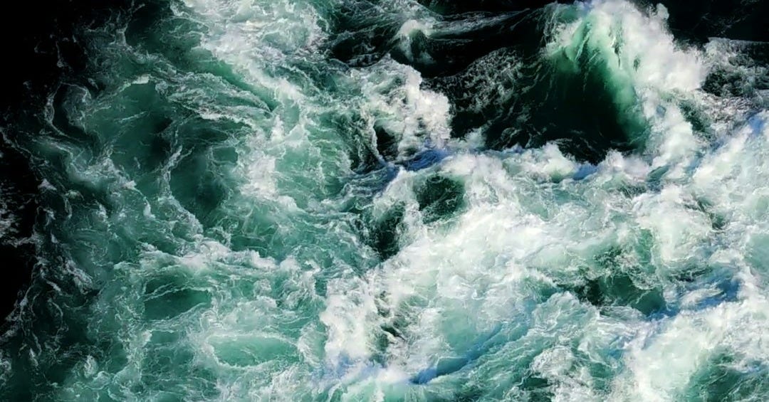 A large body of water surrounded by waves