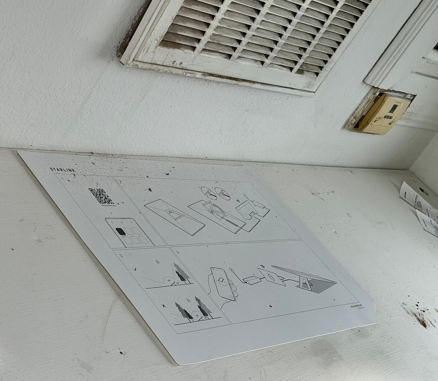 Starlink set-up instructions on a construction shed desk