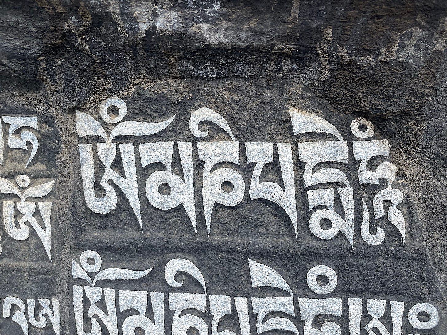 We passed numerous giant stones carved with Buddhist mantras. This one says “Om mane padme hum.”