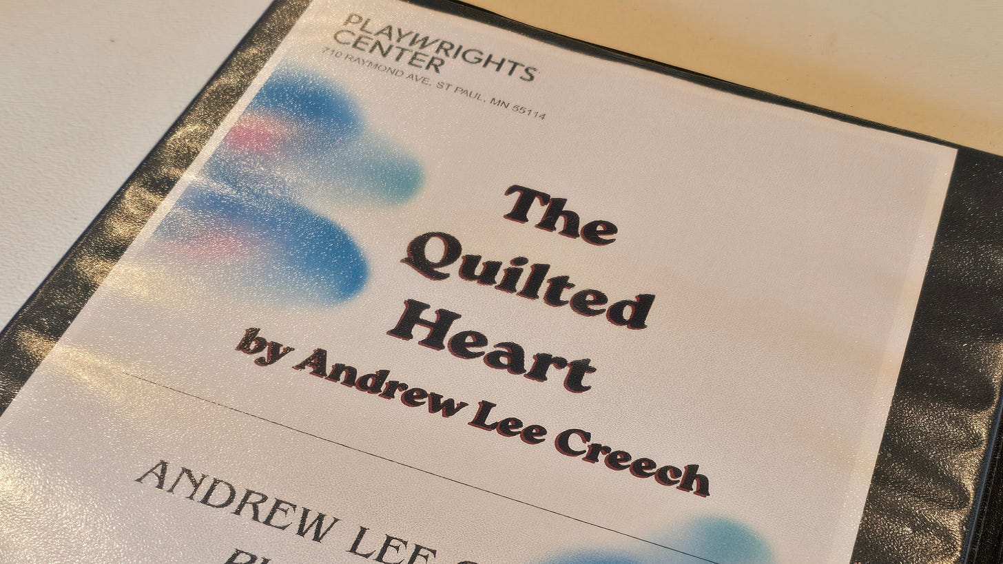 A rehearsal binder displaying the title page of The Quilted Heart by Andrew Lee Creech, prepared for a development workshop at Playwrights' Center in Saint Paul, Minnesota.