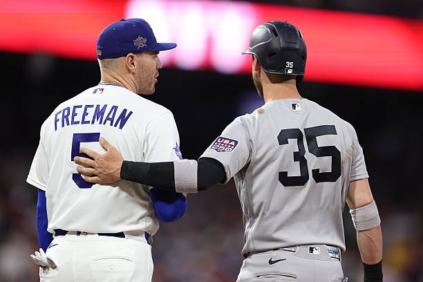 Cody Bellinger of the New York Yankees speaks with Freddie Freeman of the Los Angeles Dodgers during the first inning of the 2026 MLB All-Star Game... Cody Bellinger of the New York Yankees speaks with Freddie Freeman of the Los Angeles Dodgers during the first inning of the 2026 MLB All-Star Game...