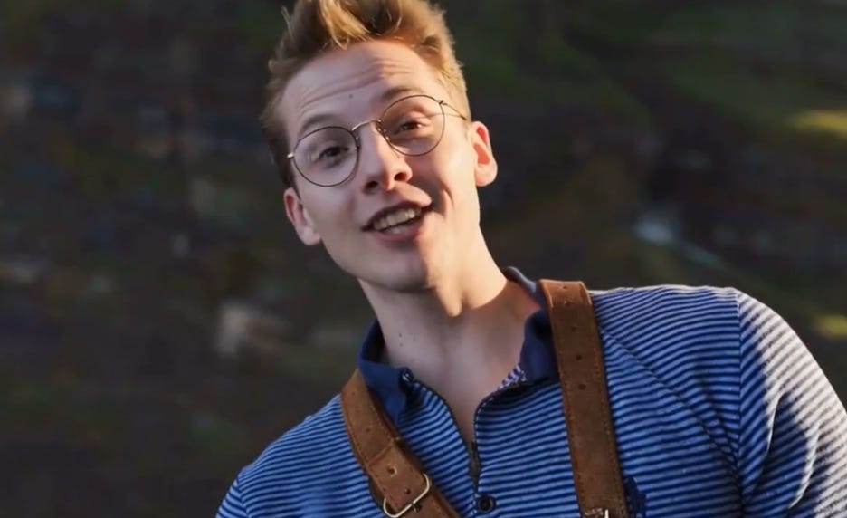 A person wearing glasses and a striped shirt

AI-generated content may be incorrect.