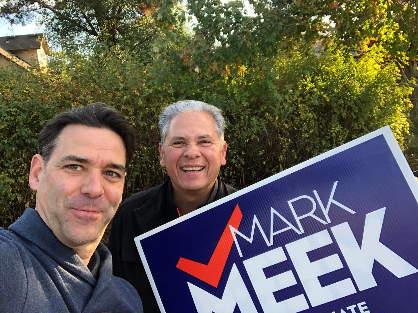 May be an image of 2 people, outdoors and text that says 'MEEK MARK' May be an image of 2 people, outdoors and text that says 'MEEK MARK'