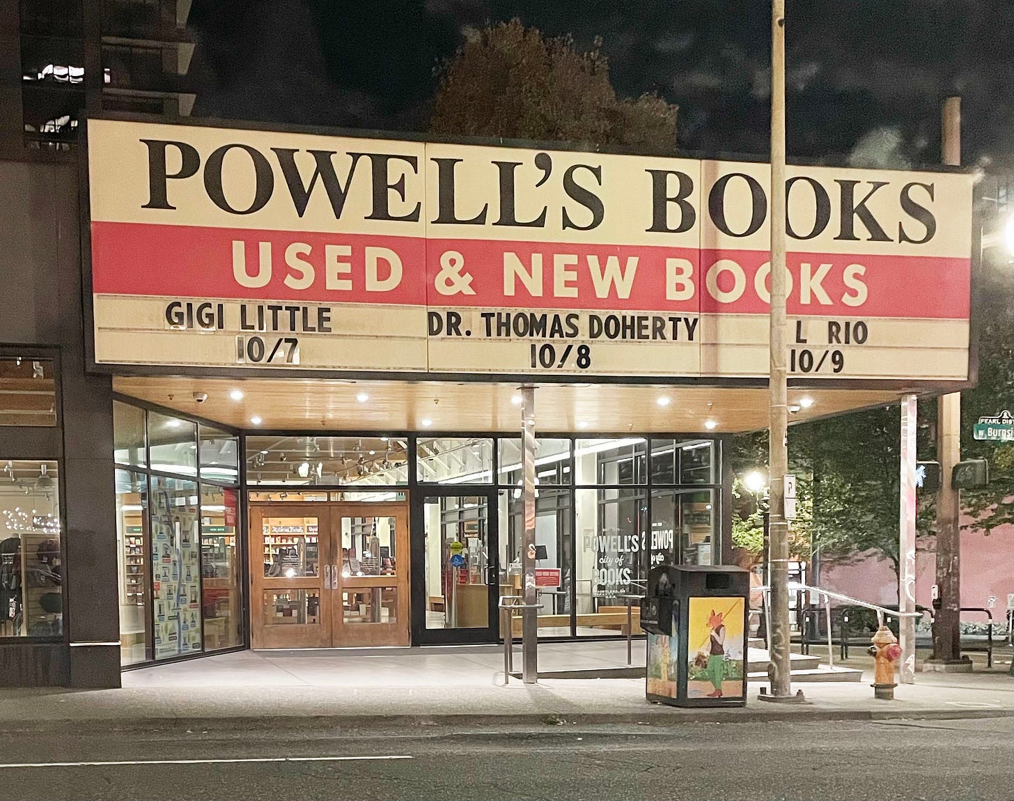 A late night, soft lighting image of the Powell's marquee with Gigi's name on it, dated 10/7. Photo by Gigi Little. 