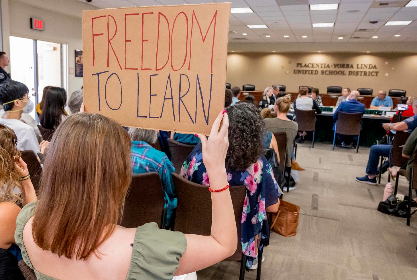 A student holds up a sign against banning CRT holds up a sign as members of the Placentia-Yorba Linda Unified School Board meet in Placentia on Wednesday, March 23, 2022 to consider banning the academic concept of critical race theory in the district. Some parents worry that language in a proposed CRT resolution could lead to the loss of Advanced Placement classes. (Photo by Leonard Ortiz/MediaNews Group/Orange County Register via Getty Images) A student holds up a sign against banning CRT holds up a sign as members of the Placentia-Yorba Linda Unified School Board meet in Placentia on Wednesday, March 23, 2022 to consider banning the academic concept of critical race theory in the district. Some parents worry that language in a proposed CRT resolution could lead to the loss of Advanced Placement classes. (Photo by Leonard Ortiz/MediaNews Group/Orange County Register via Getty Images)