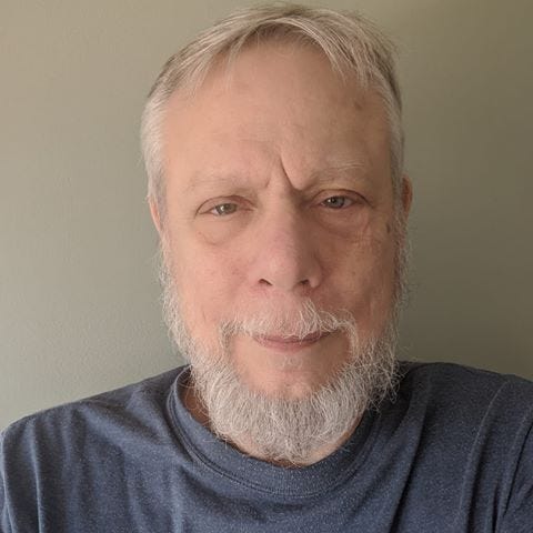 May be an image of one or more people and beard
