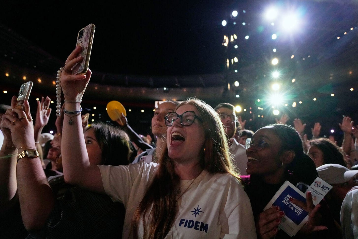 Young people photograph Pope Leo XIV at the Stade de France Young people photograph Pope Leo XIV at the Stade de France
