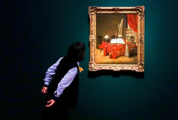 A man in a black waist coat and striped shirt peeks at a small Dutch Baroque painting alone against a dark wall, as if in surprise.