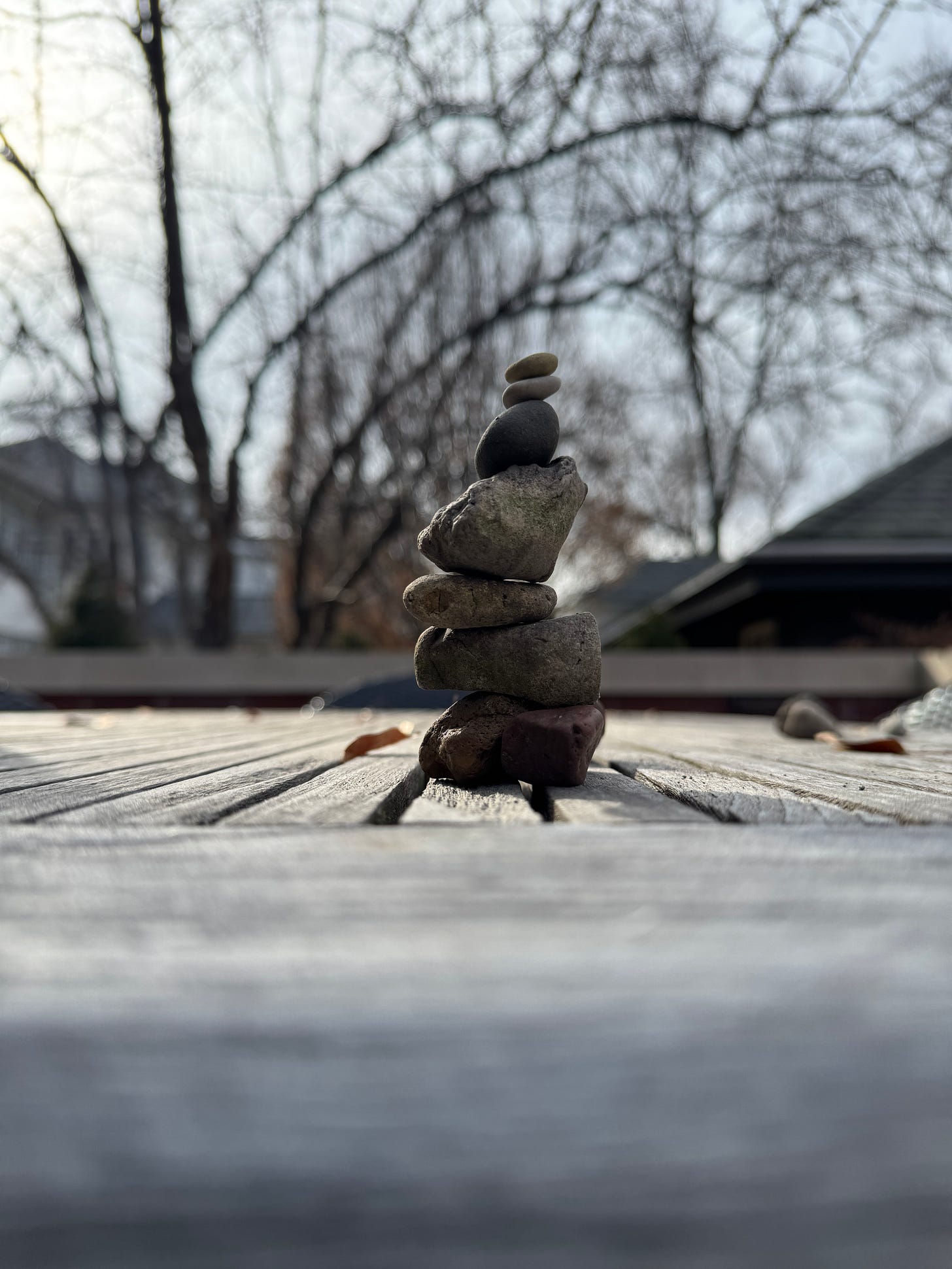 a small stack of oddly shaped stones on my patio table. a small stack of oddly shaped stones on my patio table.